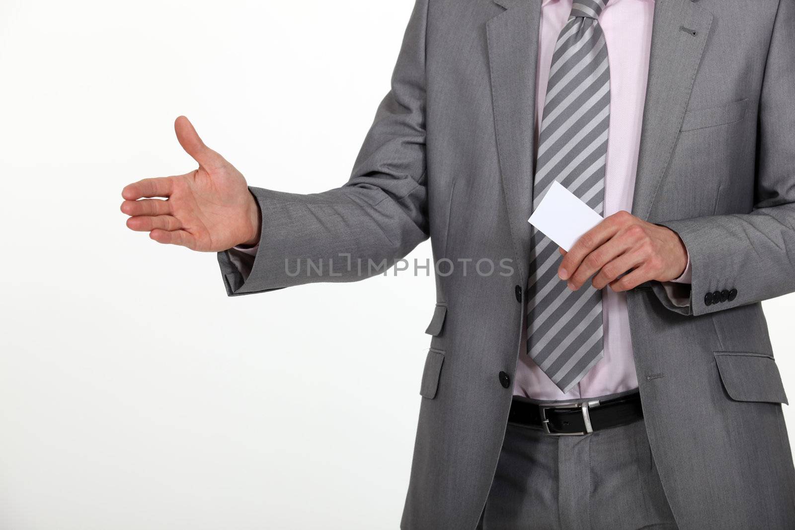 Man holding hand out and carrying business card by phovoir