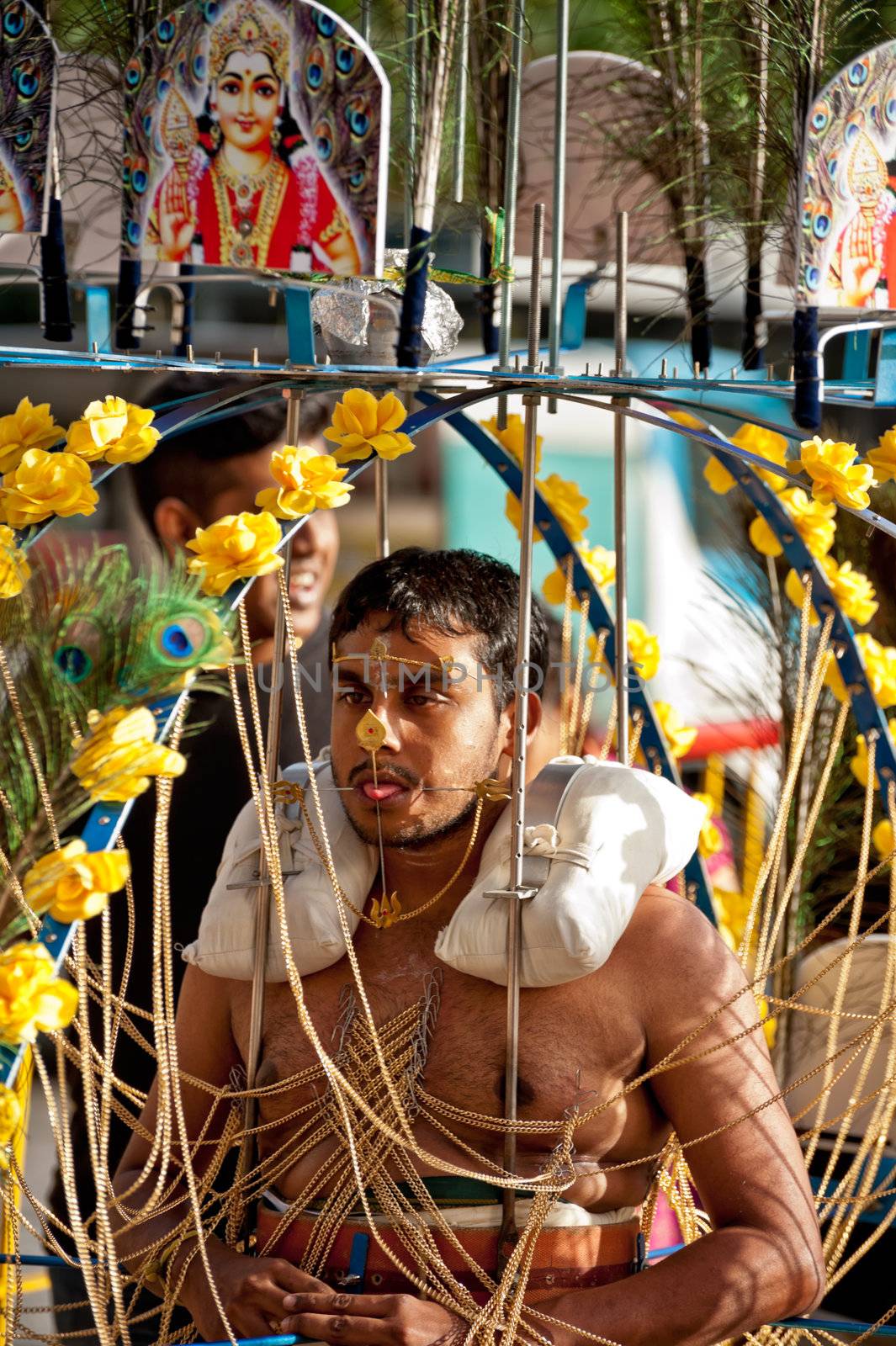SINGAPORE – 2013 JANUARY 27: Devotee carrying a kavadi at Thaipusam taken on January 27, 2013 in Singapore. Hindu festival to worship and to make offerings to god Muruga. EDITORIAL USE ONLY!! 