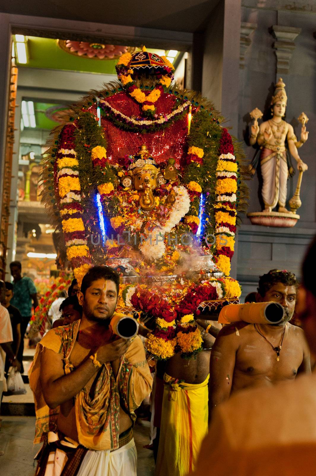 SINGAPORE – 2013 JANUARY 27: Devotee carrying a kavadi at Thaipusam taken on January 27, 2013 in Singapore. Hindu festival to worship and to make offerings to god Muruga. EDITORIAL USE ONLY!! 