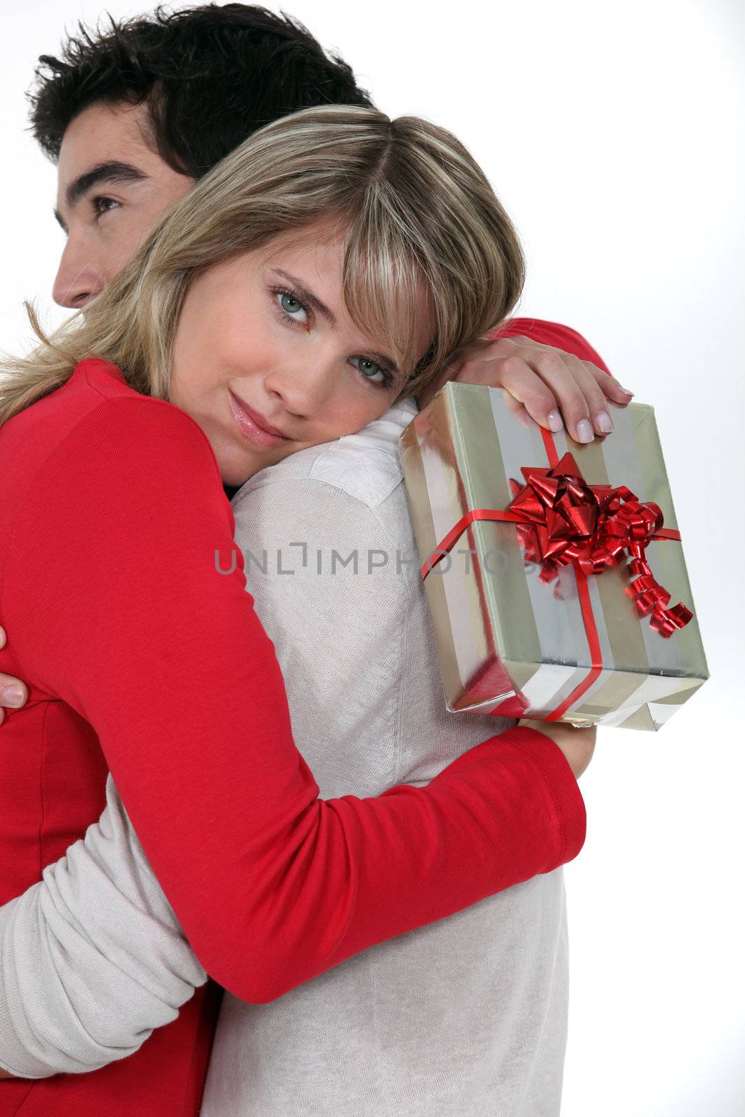 Woman thanking her boyfriend for his gift by phovoir