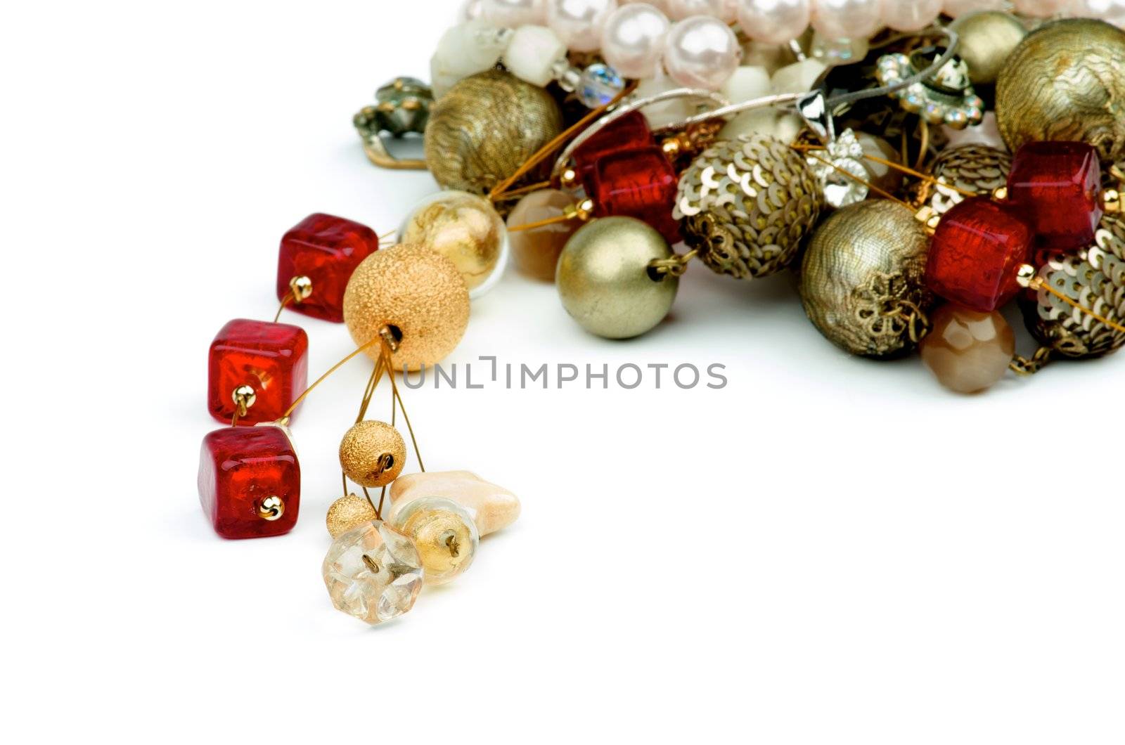 Heap of Gold Pendant, Ruby Necklace, Pearl and Jewelry closeup on white background