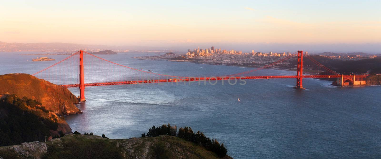 sunset panoramic view of the Golden Gate Bridge from the peak of by wolterk