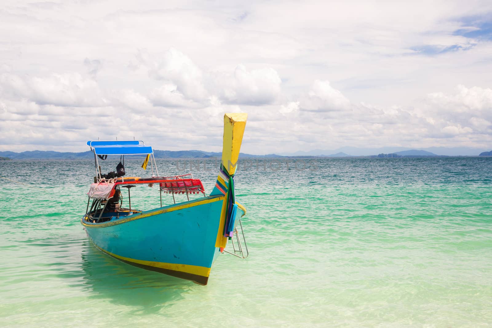 Long Tail Boat at tropical White Sand Beach Trang near Phuket Thailand