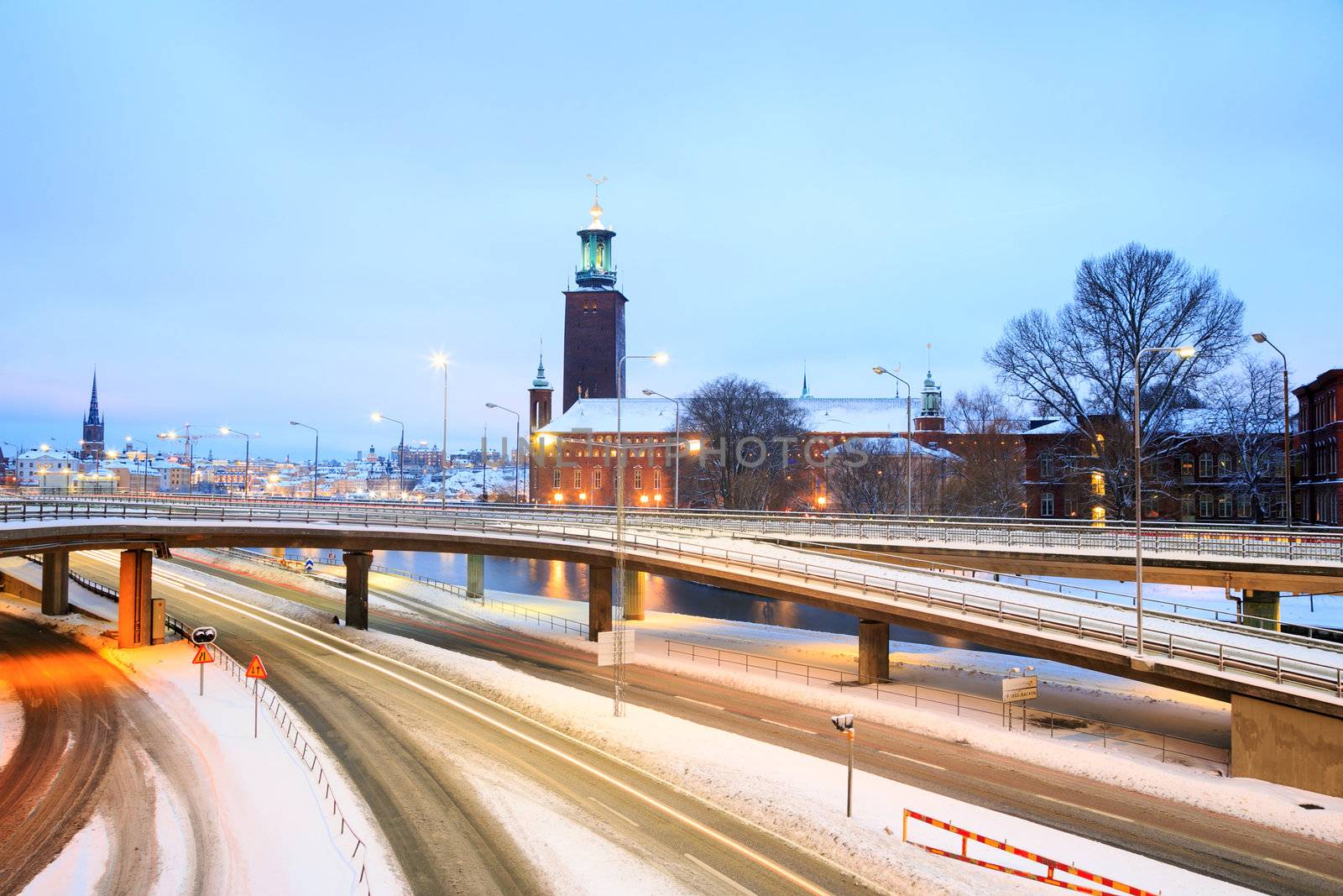 Stockholm Cityhall at dusk with transportation light trail Sweden