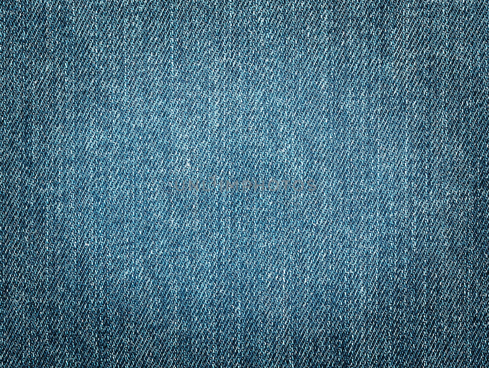 Worn denim jeans texture. Background. Close up