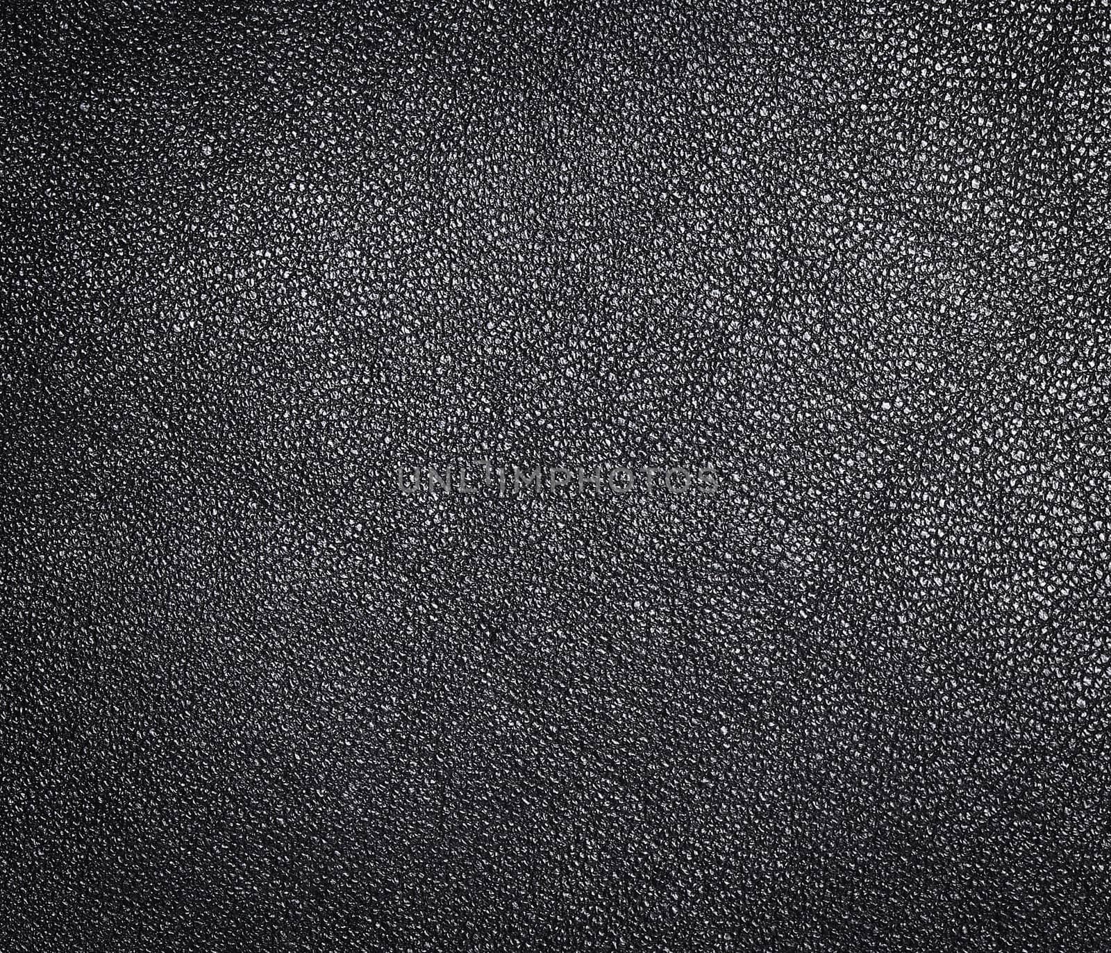 Black leather texture. Clothes background. Close up