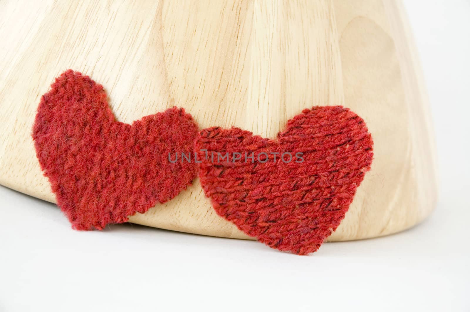 two red heart with wooden background