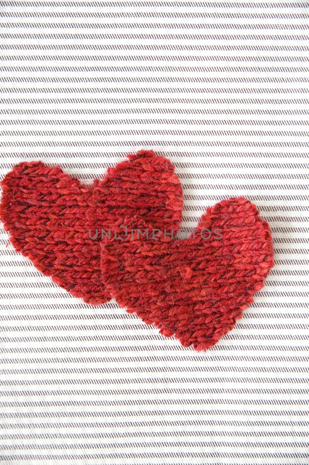 two red hearts fabric on striped background