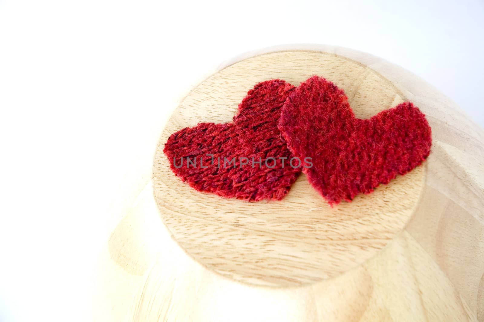 two red hearts put on wooden