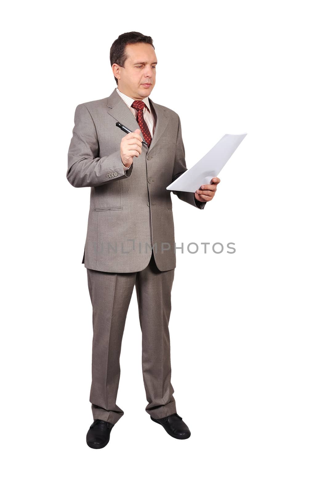 businessman with pen and paper in hand