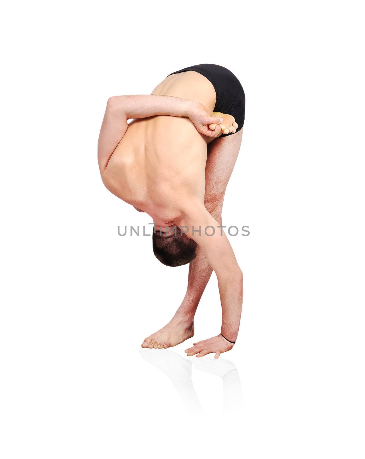 Young man doing yoga exercise  on a white background