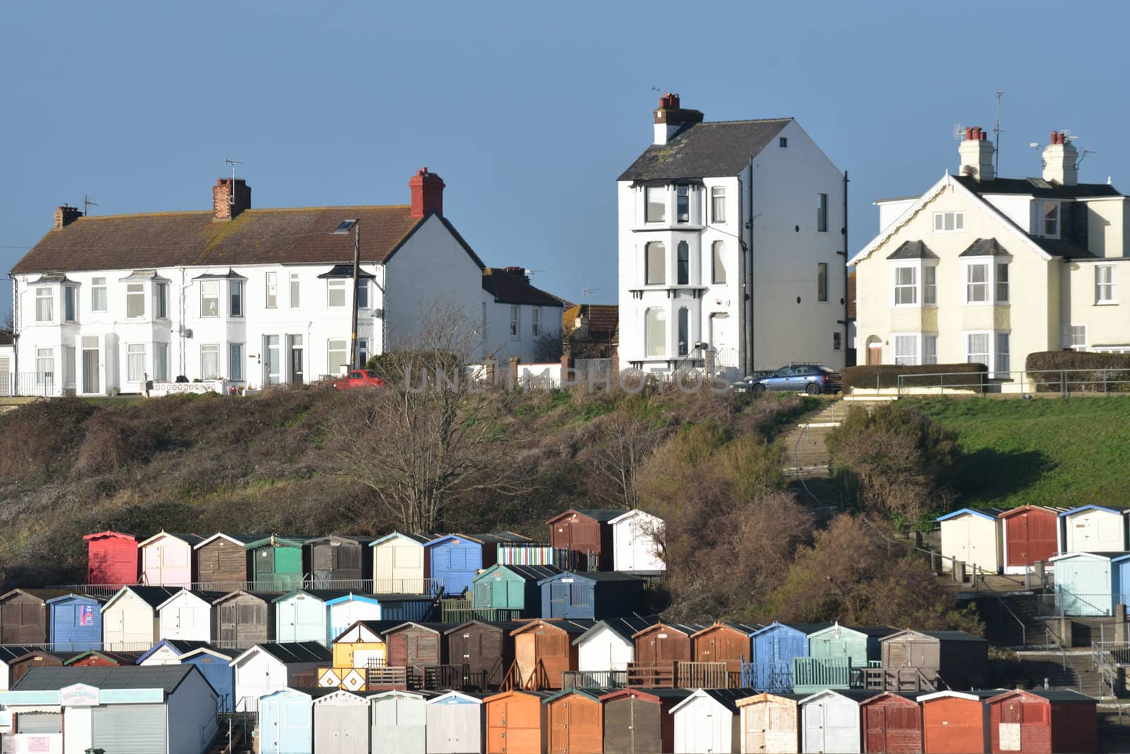 View of Beach huts and houses at Walton on Naze