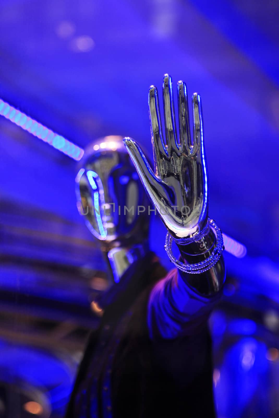 Silver dummies in a show-window of shop
