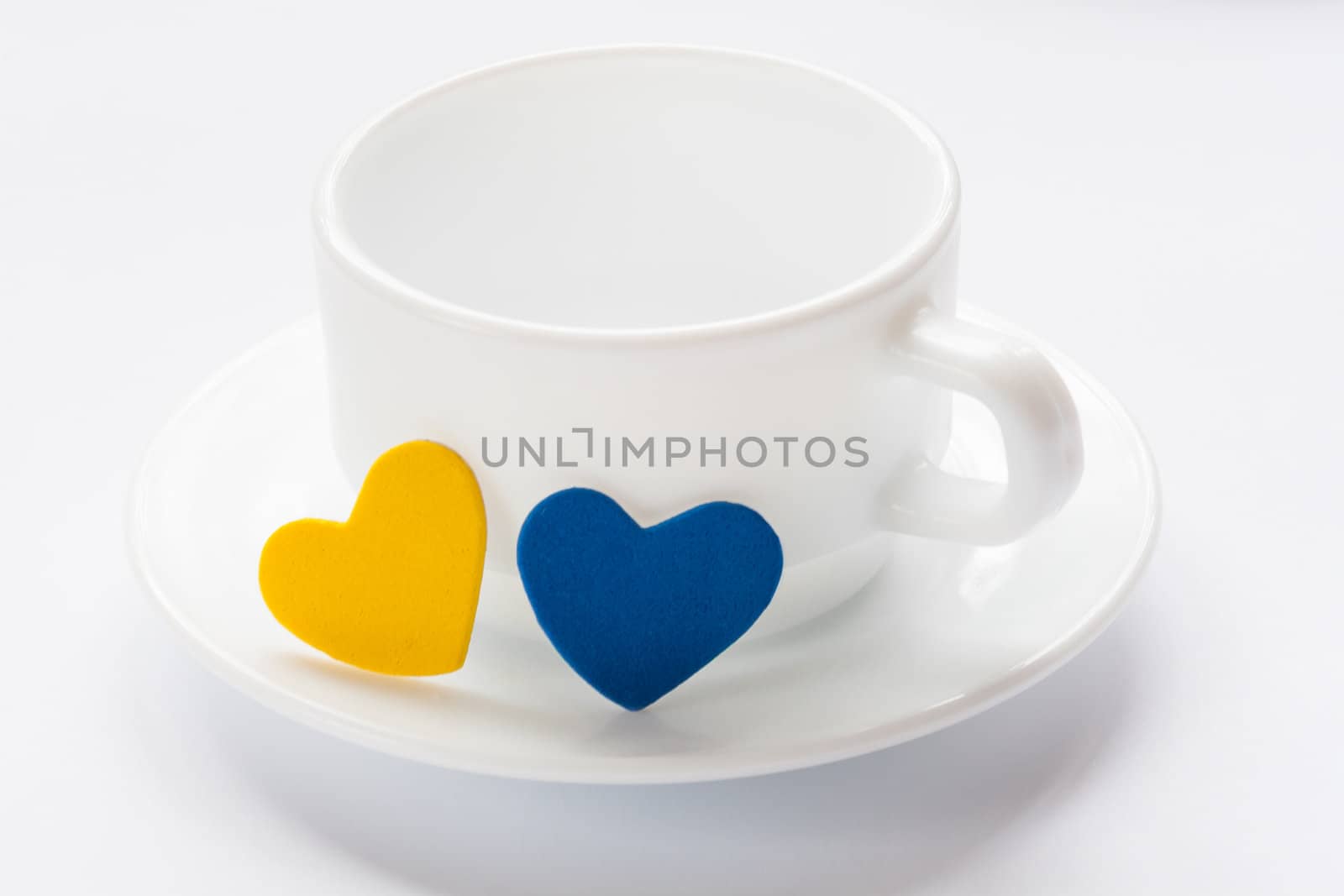 empty cup and saucer with hearts by sfinks