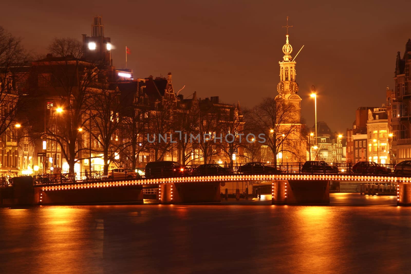 Amsterdam by night with the Munt tower in the Netherlands