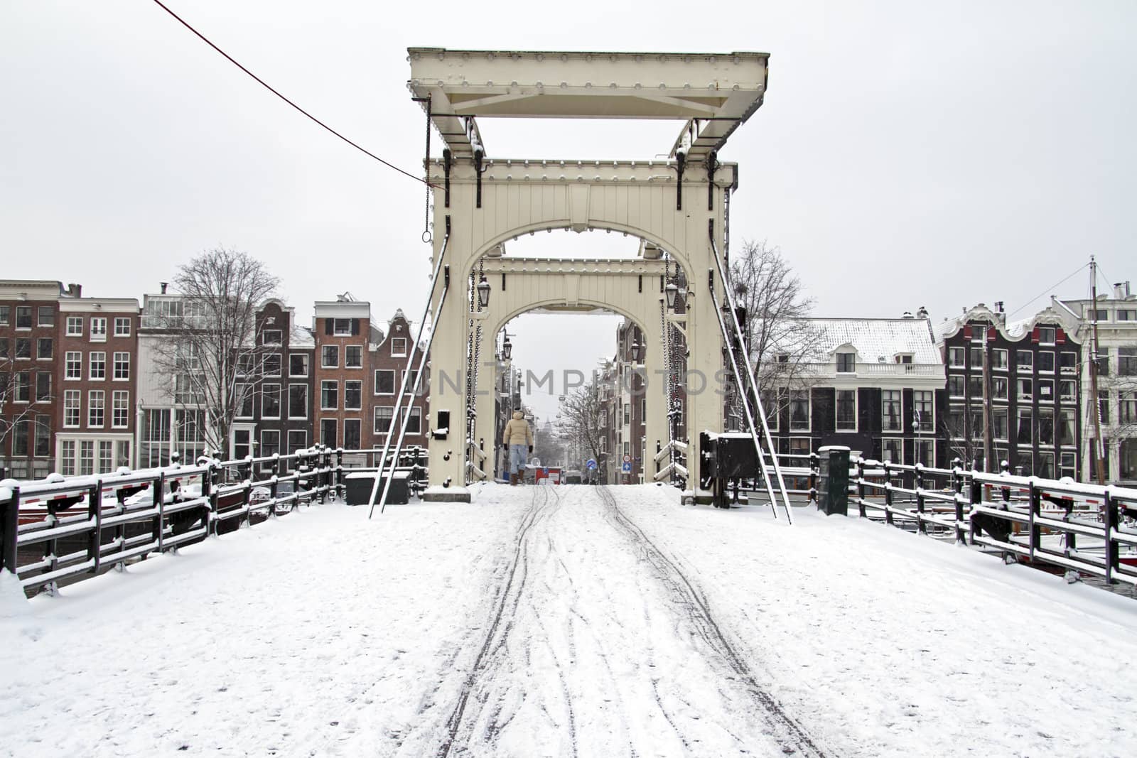 Snowy thiny bridge in Amsterdam the Netherlands in winter