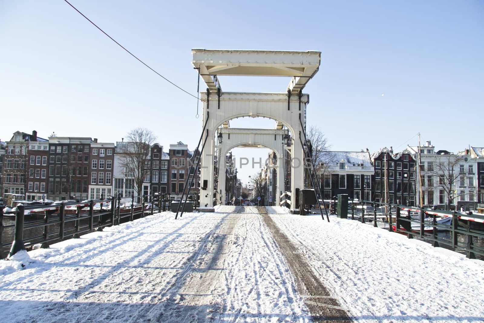 Snowy thiny bridge in Amsterdam the Netherlands in winter