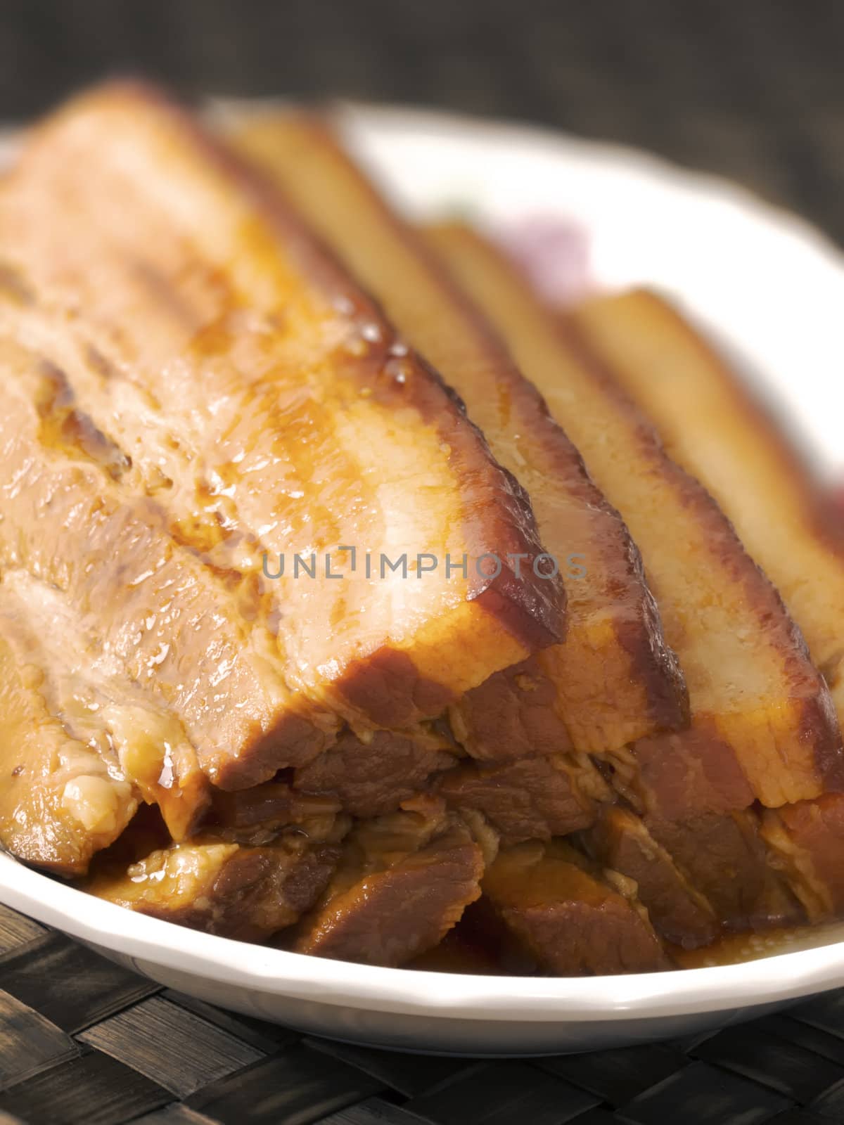 close up of a plate of braised pork belly
