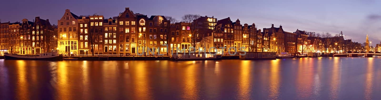 Panorama from Amsterdam with the Munt tower in the Netherlands at twilight