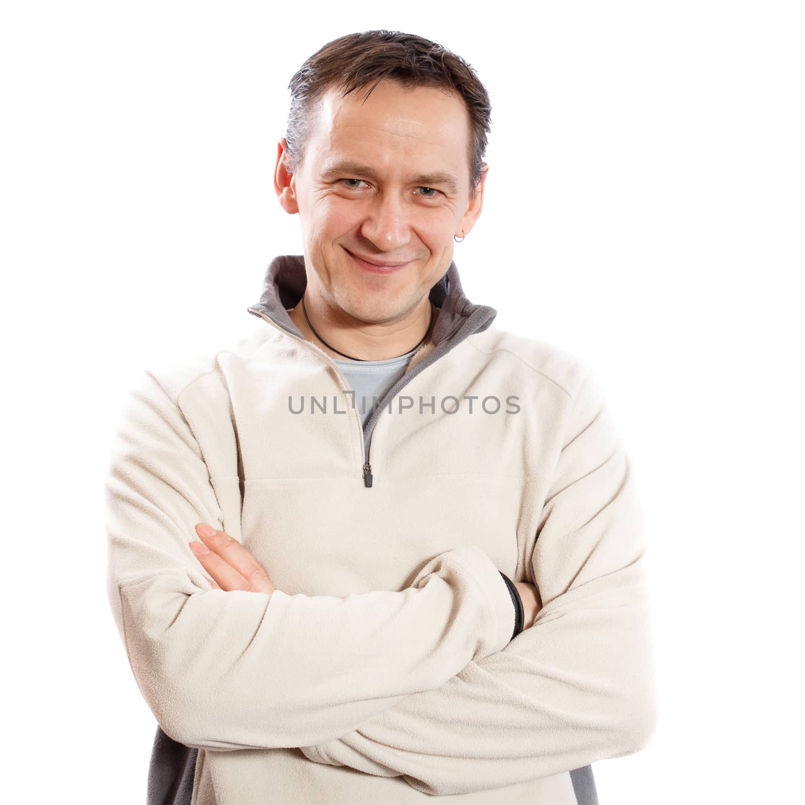 Casual man looking at camera with arms crossed on white background