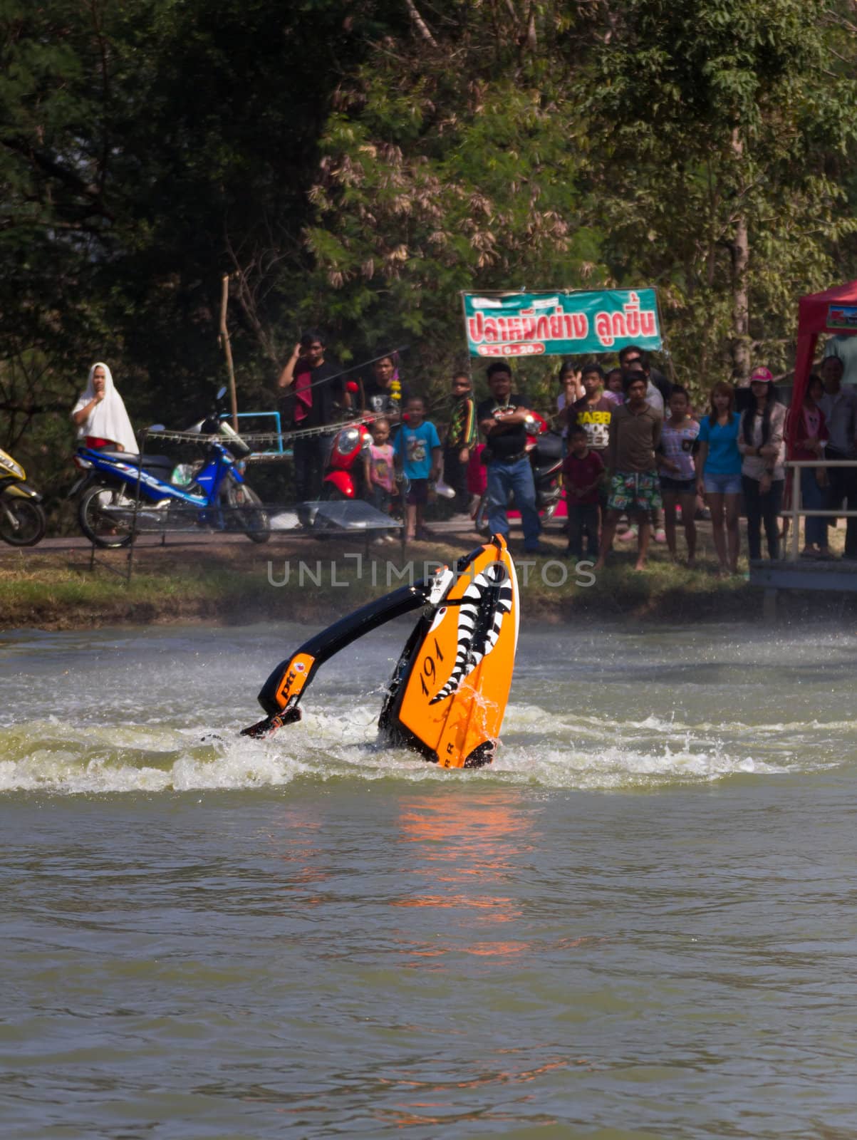 SARABURI THAILAND-JANUARY 20: Boonlue Korbangyang in action during show Freestyle the Jet ski  stunt action  on Jan 20, 2013 in SARABURI,Thailand.