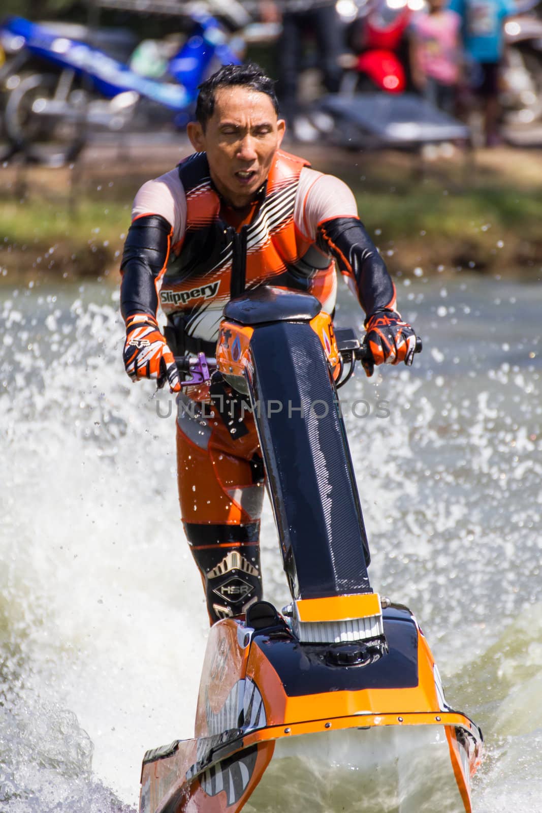 SARABURI THAILAND-JANUARY 20: Boonlue Korbangyang in action during show Freestyle the Jet ski  stunt action  on Jan 20, 2013 in SARABURI,Thailand.