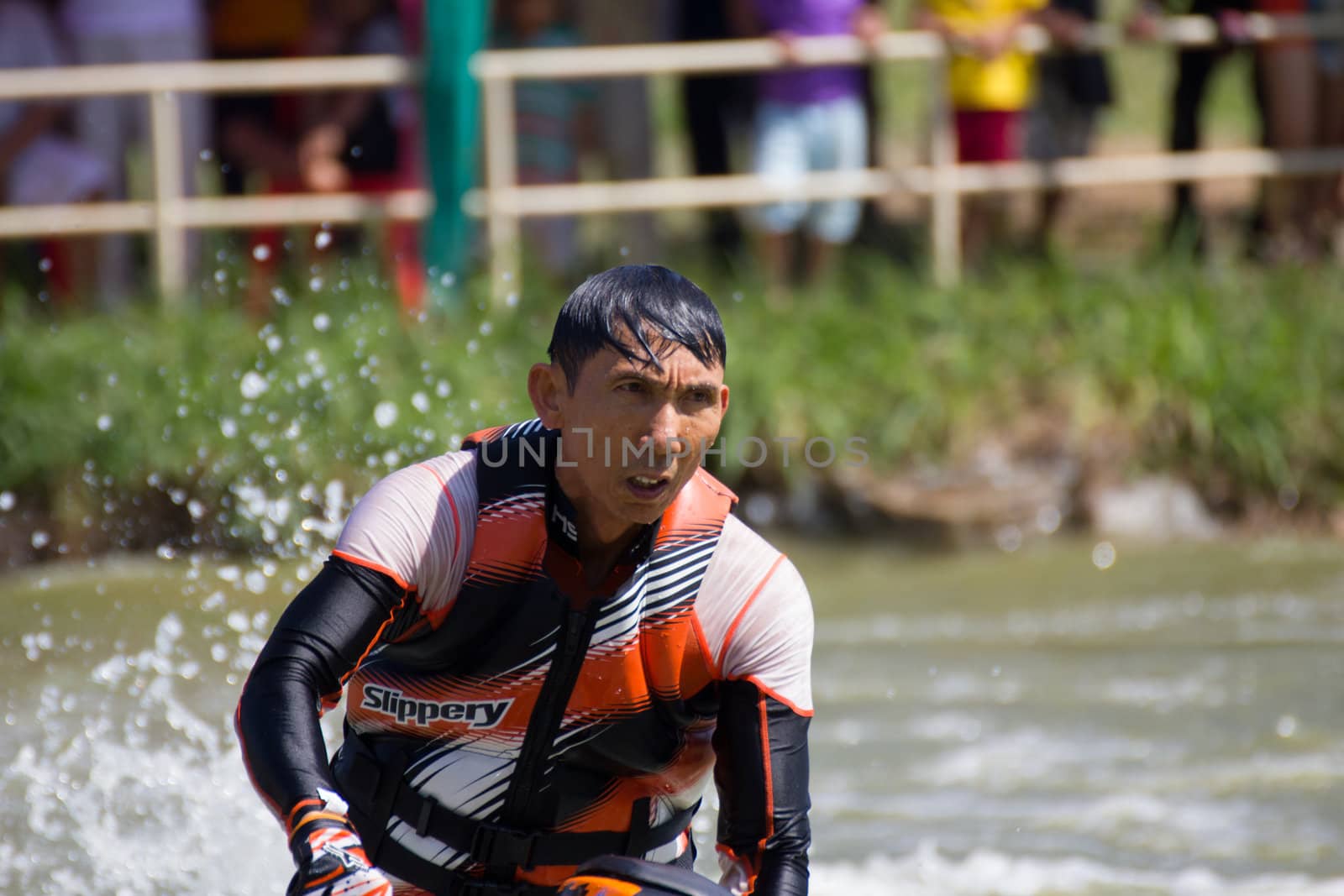 SARABURI THAILAND-JANUARY 20: Boonlue Korbangyang in action during show Freestyle the Jet ski  stunt action  on Jan 20, 2013 in SARABURI,Thailand.