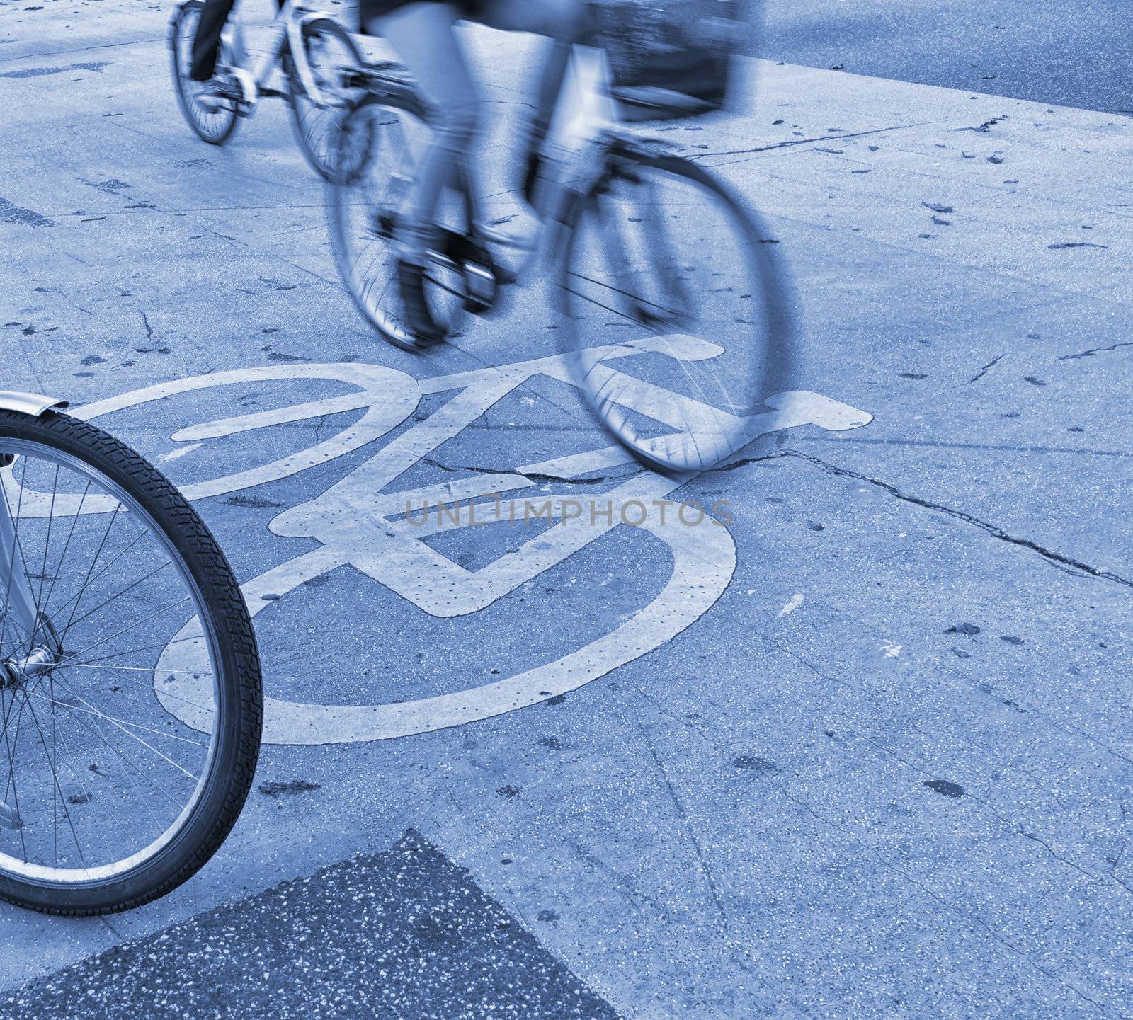 Morning bicycle traffic in the city. People on their way to work.