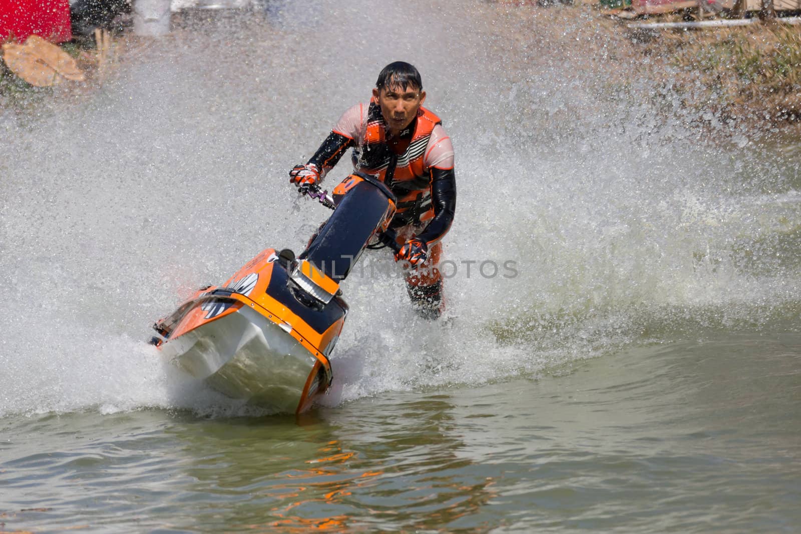 SARABURI THAILAND-JANUARY 20: Boonlue Korbangyang in action during show Freestyle the Jet ski  stunt action  on Jan 20, 2013 in SARABURI,Thailand.