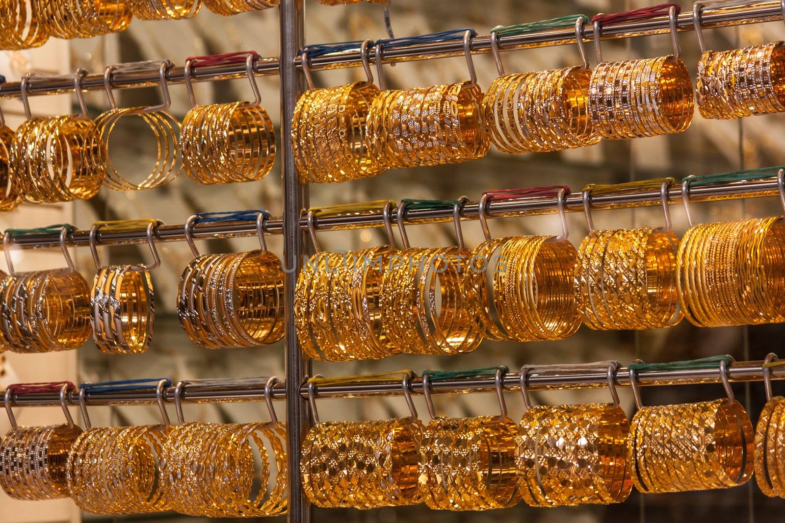 gold bracelets in a window in the gols souq, dubai, united arab emirates