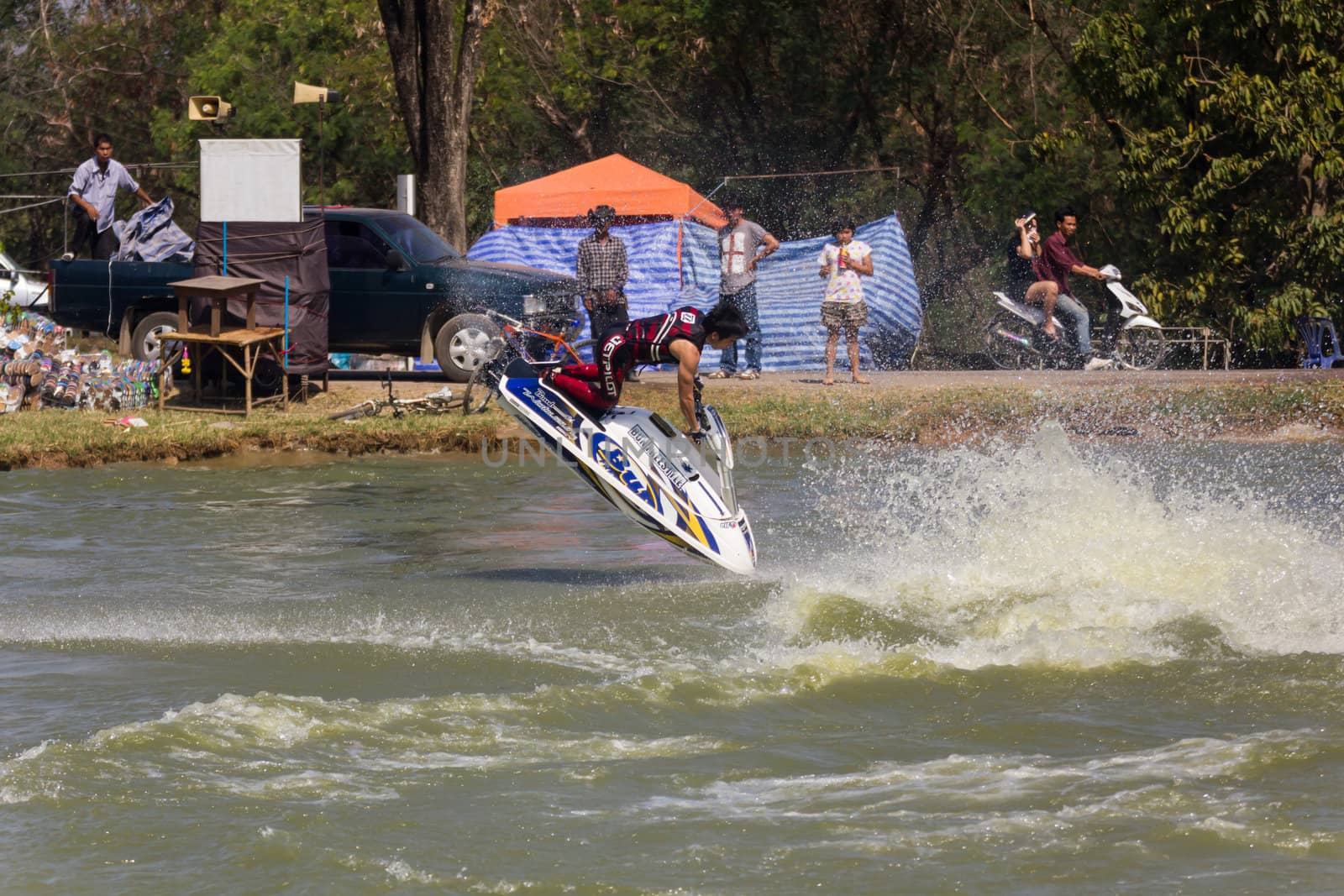SARABURI THAILAND-JANUARY 20: Sonswut Rappasubpisan in action during show Freestyle the Jet ski  stunt action  on Jan 20, 2013 in SARABURI,Thailand.