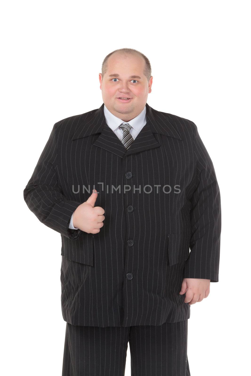 Elegant very fat man in a black suit shows thumb-up, on white background