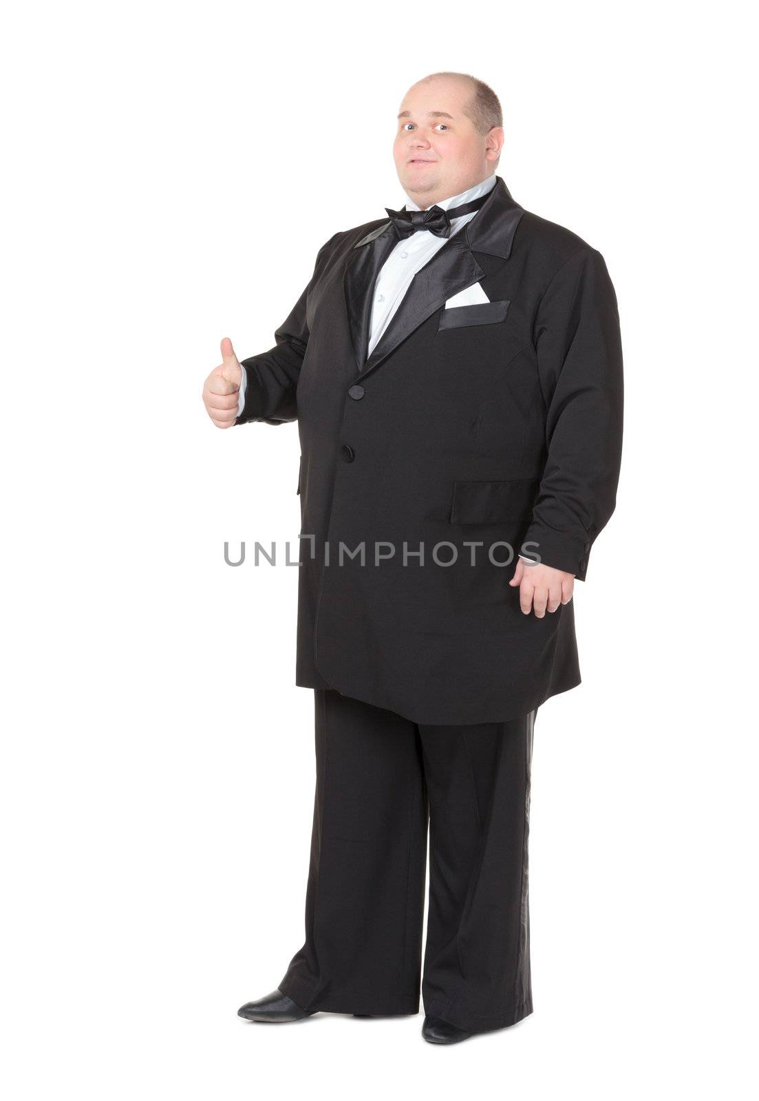 Elegant fat man in a tuxedo shows thumb-up by Discovod