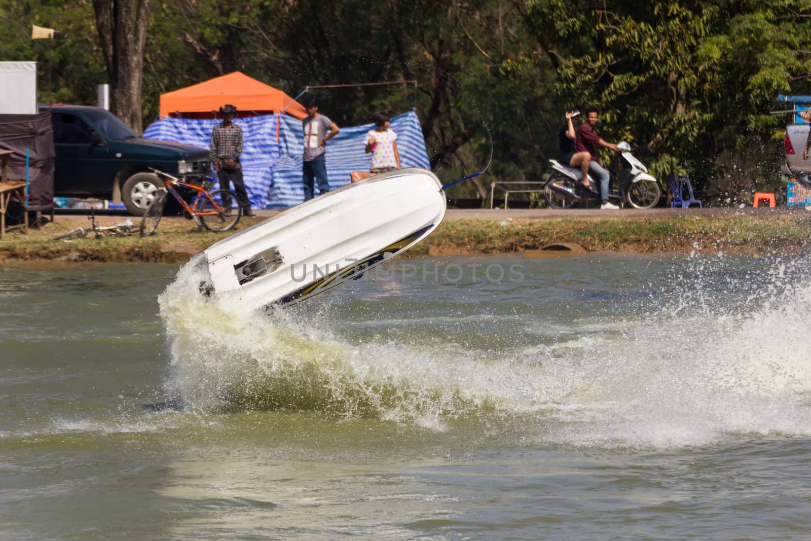 SARABURI THAILAND-JANUARY 20: Sonswut Rappasubpisan in action during show Freestyle the Jet ski  stunt action  on Jan 20, 2013 in SARABURI,Thailand.
