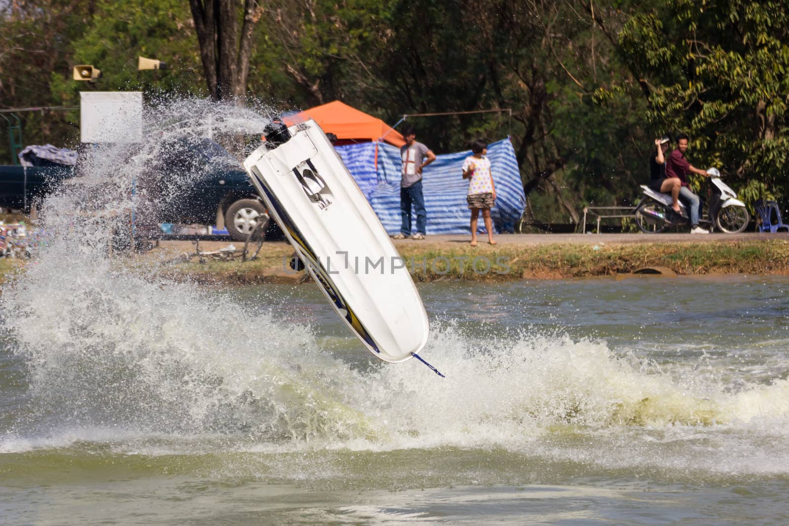 SARABURI THAILAND-JANUARY 20: Sonswut Rappasubpisan in action during show Freestyle the Jet ski  stunt action  on Jan 20, 2013 in SARABURI,Thailand.
