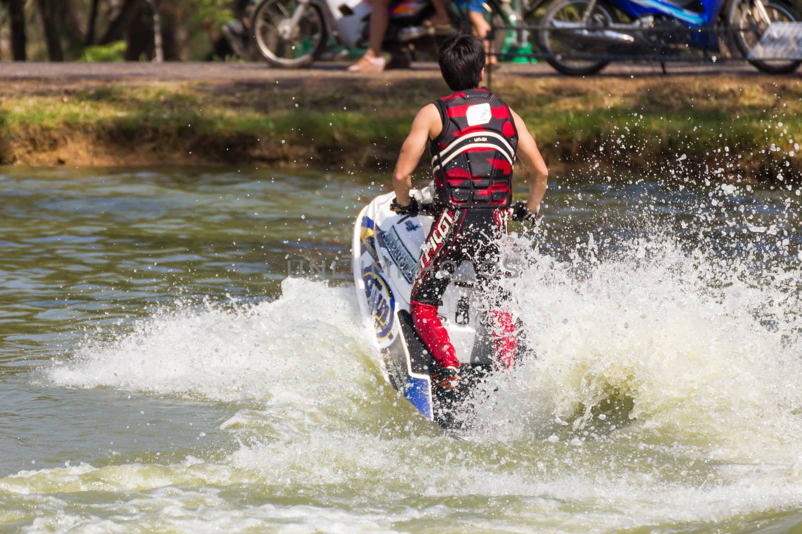 SARABURI THAILAND-JANUARY 20: Sonswut Rappasubpisan in action during show Freestyle the Jet ski  stunt action  on Jan 20, 2013 in SARABURI,Thailand.
