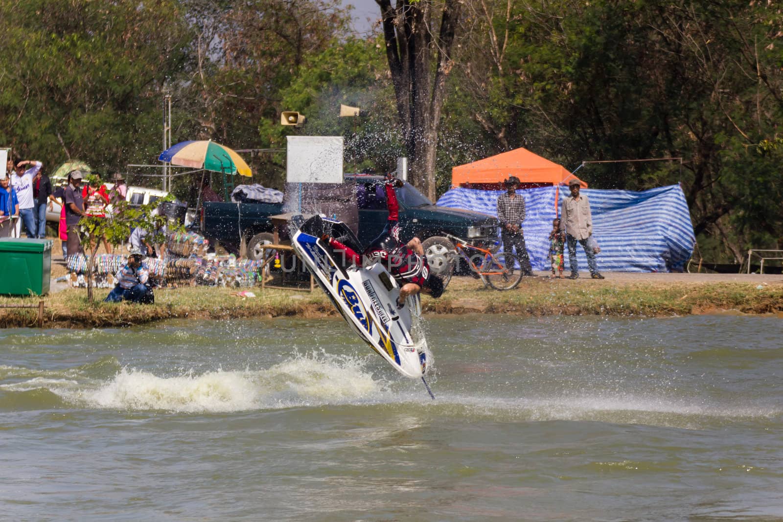 SARABURI THAILAND-JANUARY 20: Sonswut Rappasubpisan in action during show Freestyle the Jet ski  stunt action  on Jan 20, 2013 in SARABURI,Thailand.