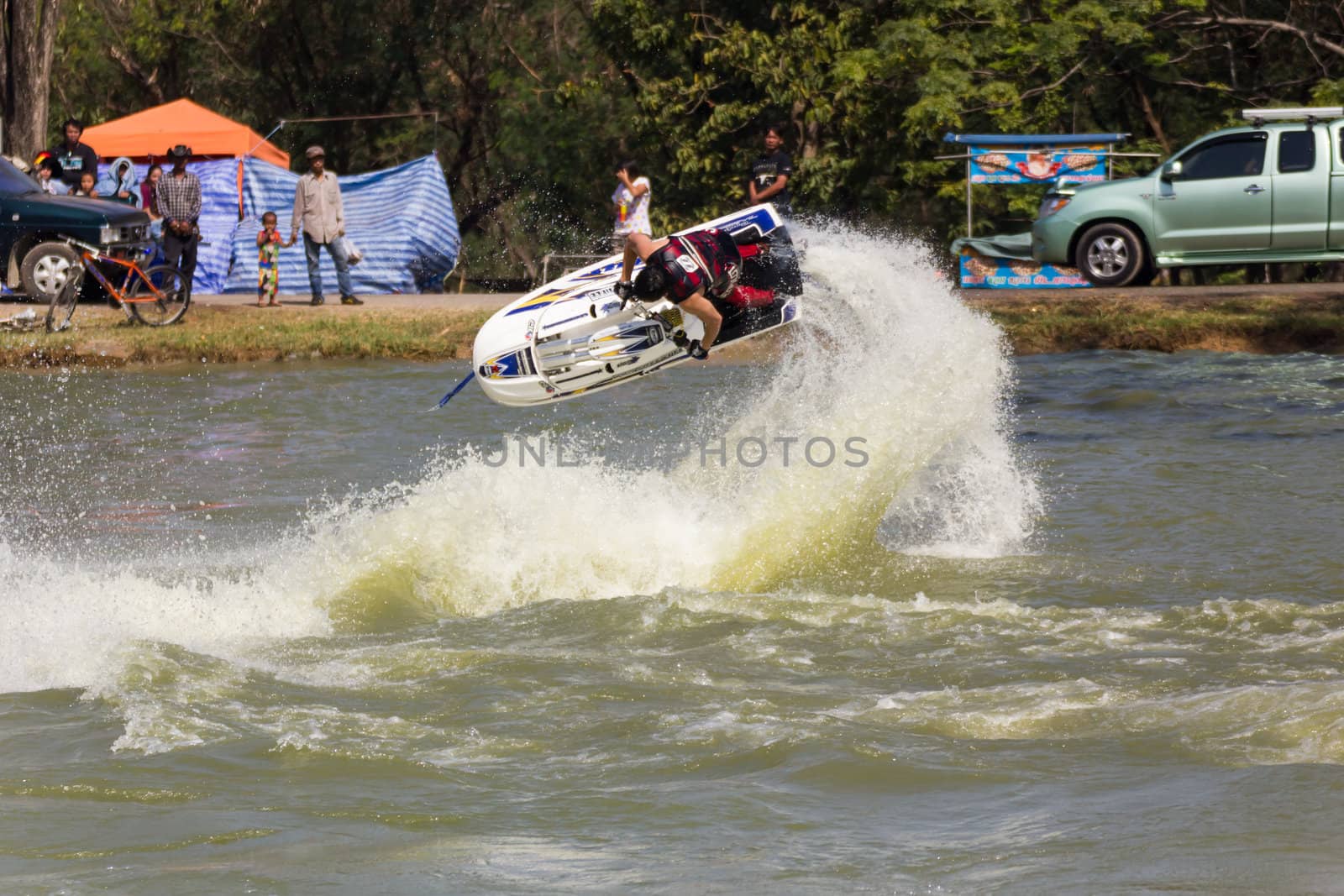 SARABURI THAILAND-JANUARY 20: Sonswut Rappasubpisan in action during show Freestyle the Jet ski  stunt action  on Jan 20, 2013 in SARABURI,Thailand.