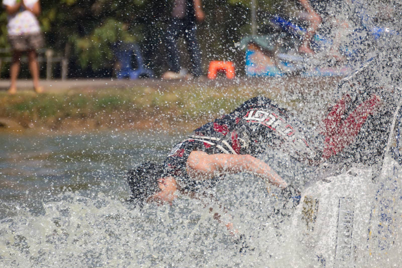 SARABURI THAILAND-JANUARY 20: Sonswut Rappasubpisan in action during show Freestyle the Jet ski  stunt action  on Jan 20, 2013 in SARABURI,Thailand.