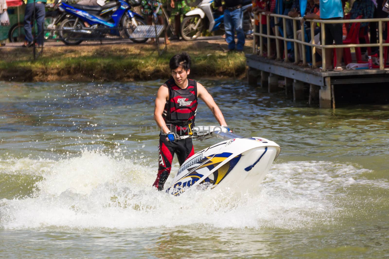 SARABURI THAILAND-JANUARY 20: Sonswut Rappasubpisan in action during show Freestyle the Jet ski  stunt action  on Jan 20, 2013 in SARABURI,Thailand.