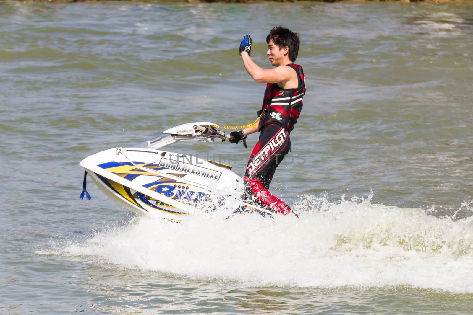 SARABURI THAILAND-JANUARY 20: Sonswut Rappasubpisan in action during show Freestyle the Jet ski  stunt action  on Jan 20, 2013 in SARABURI,Thailand.