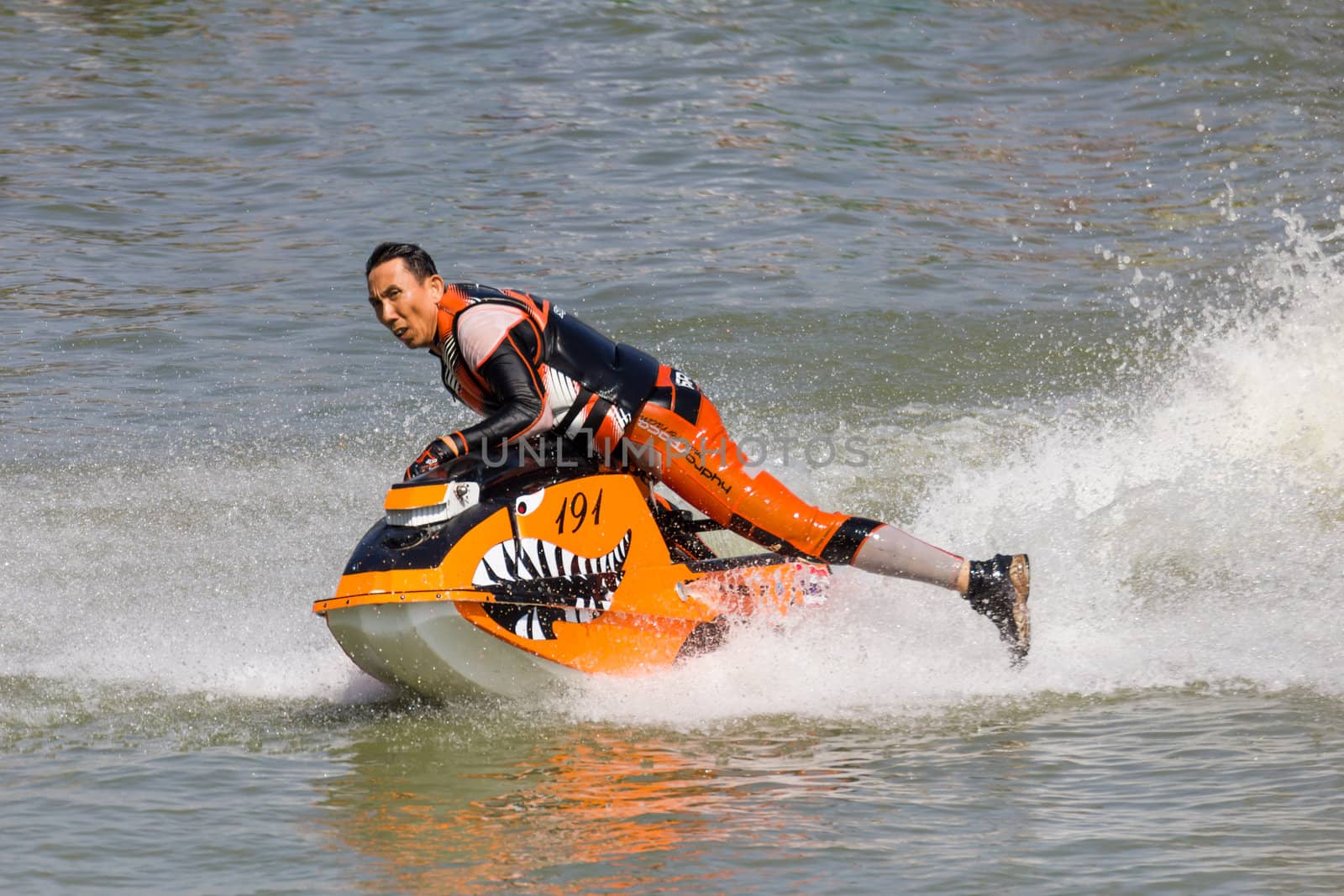 SARABURI THAILAND-JANUARY 20: Boonlue Korbangyang in action during show Freestyle the Jet ski  stunt action  on Jan 20, 2013 in SARABURI,Thailand.