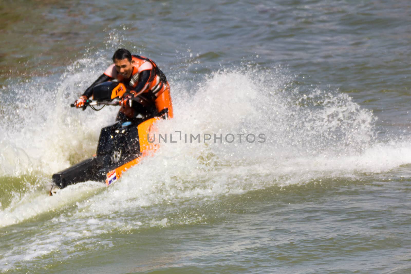 SARABURI THAILAND-JANUARY 20: Boonlue Korbangyang in action during show Freestyle the Jet ski  stunt action  on Jan 20, 2013 in SARABURI,Thailand.