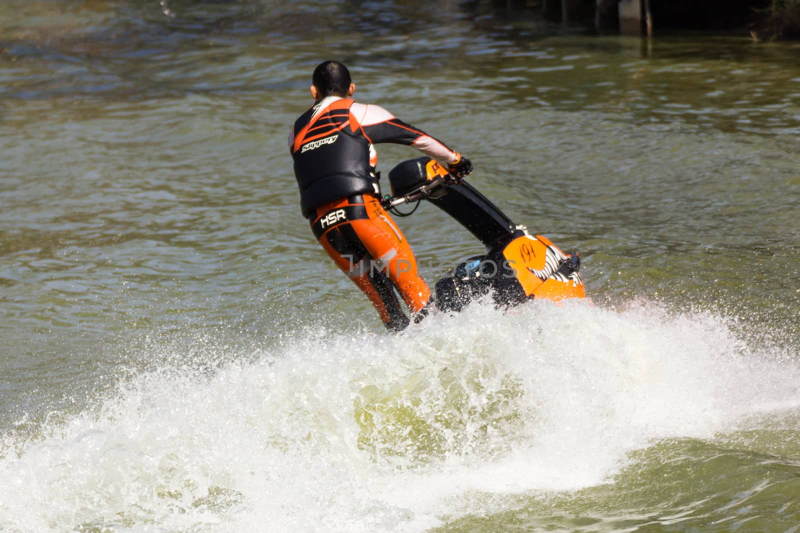 SARABURI THAILAND-JANUARY 20: Boonlue Korbangyang in action during show Freestyle the Jet ski  stunt action  on Jan 20, 2013 in SARABURI,Thailand.