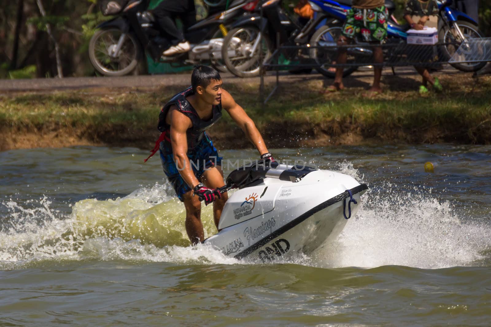 SARABURI THAILAND-JANUARY 20: Veerapong Maneechom in action during show Freestyle the Jet ski  stunt action  on Jan 20, 2013 in SARABURI,Thailand.