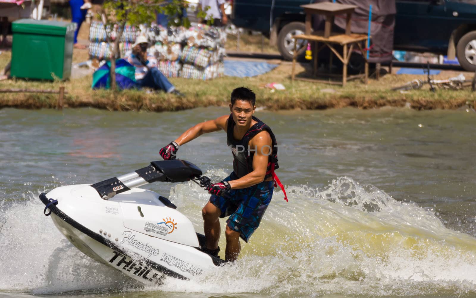 SARABURI THAILAND-JANUARY 20: Veerapong Maneechom in action during show Freestyle the Jet ski  stunt action  on Jan 20, 2013 in SARABURI,Thailand.