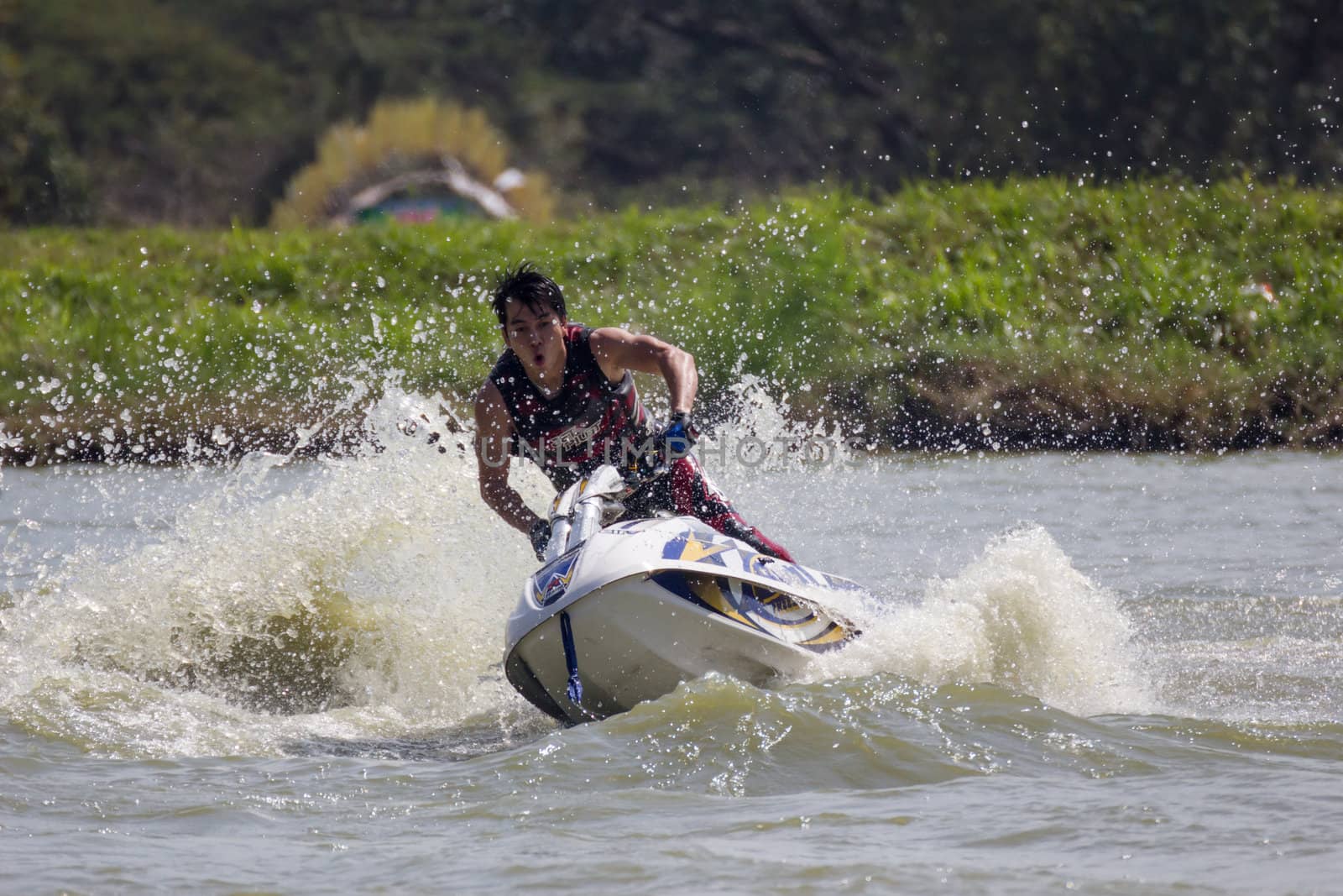 SARABURI THAILAND-JANUARY 20: Sonswut Rappasubpisan in action during show Freestyle the Jet ski  stunt action  on Jan 20, 2013 in SARABURI,Thailand.