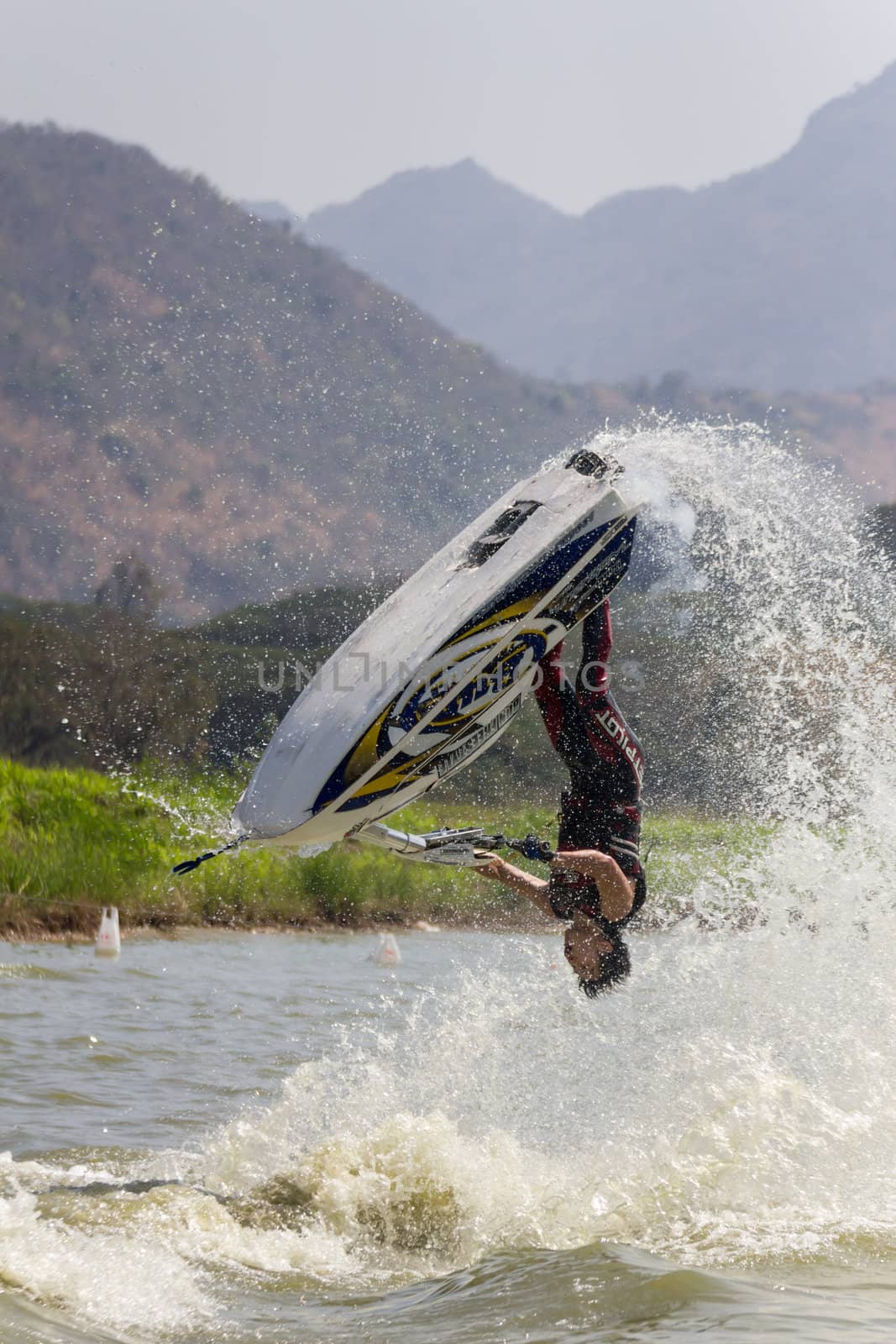 SARABURI THAILAND-JANUARY 20: Sonswut Rappasubpisan in action during show Freestyle the Jet ski  stunt action  on Jan 20, 2013 in SARABURI,Thailand.