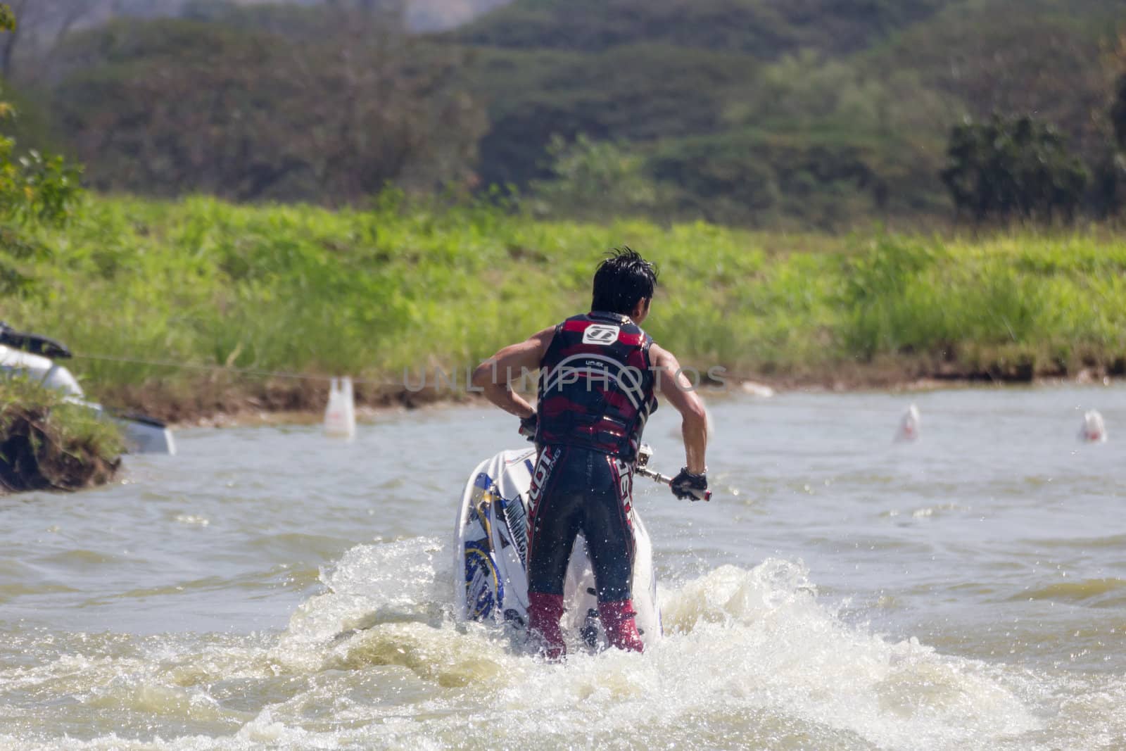 SARABURI THAILAND-JANUARY 20: Sonswut Rappasubpisan in action during show Freestyle the Jet ski  stunt action  on Jan 20, 2013 in SARABURI,Thailand.