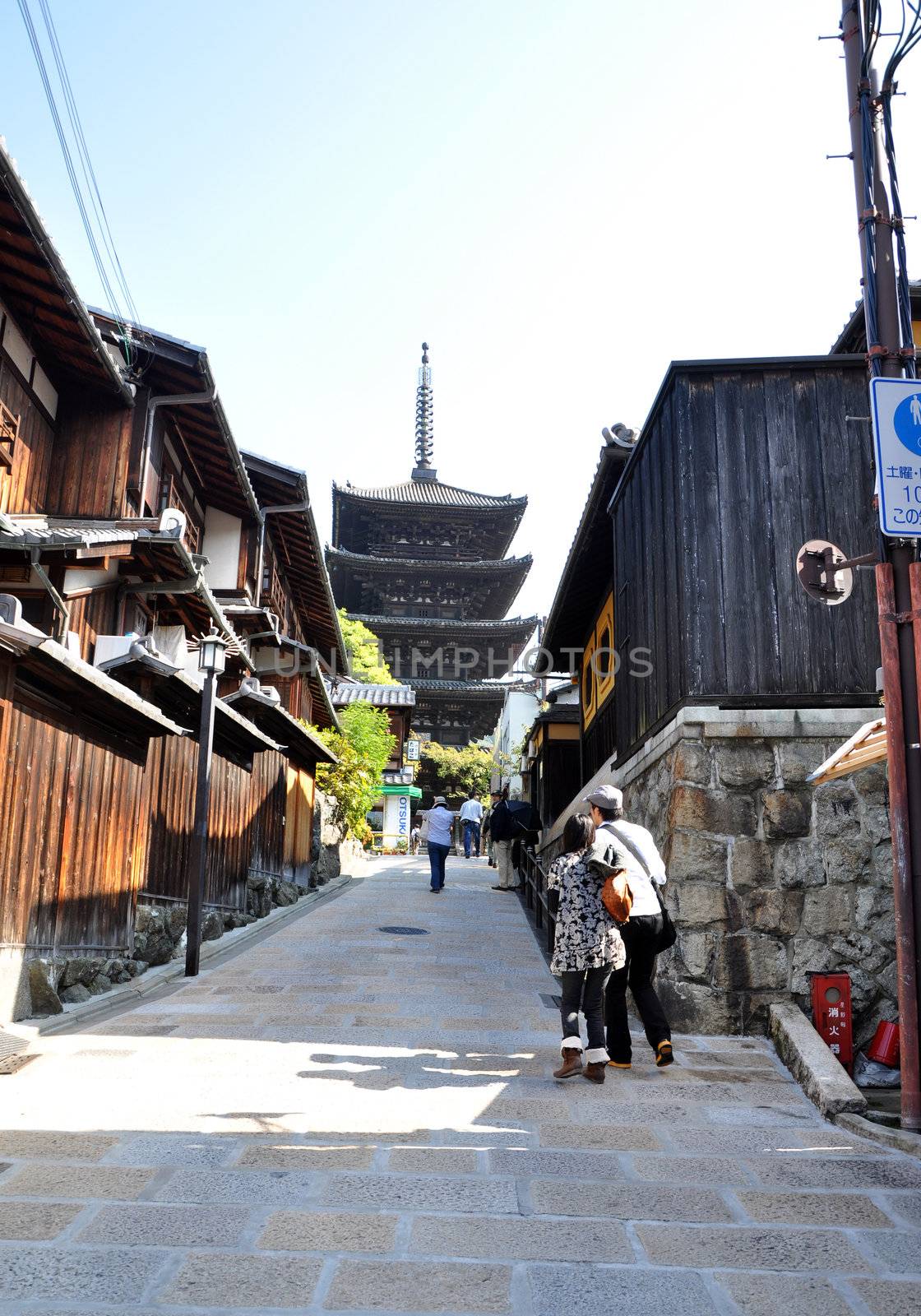 KYOTO, JAPAN - OCT 21 2012: Tourists walk on a street leading to Kiyomizu Temple on October 21 2012. Kiyomizu is a famous temple in Kyoto built in year 778.